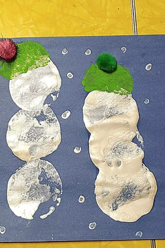 How to Make Adorable Snowman Art for Kids Glue a pom-pom onto the hat.