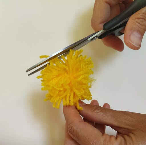 Trim the strands to form a yellow ball.